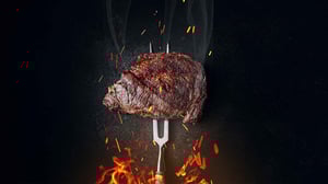 image of steak grilling