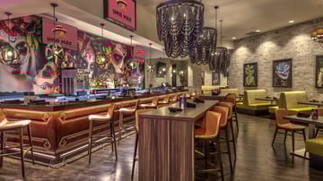 Uno-Mas-view-of-main-dining-area-and-bar_q085_1920x1080