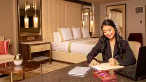 Crystal-Class-guest-in-Summit-King-Room_3840x2160-scaled1