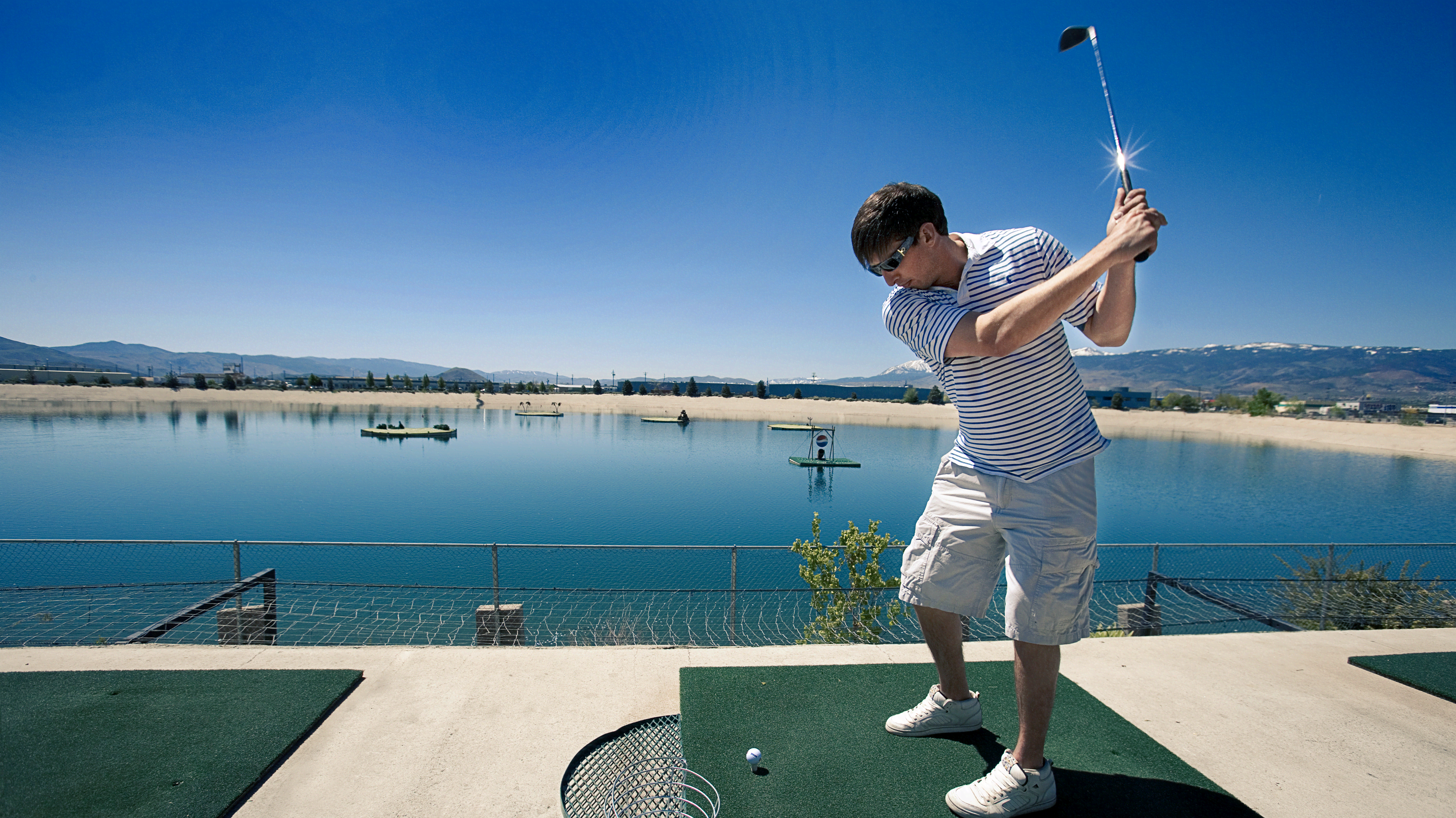 Young-man-takes-a-swing-at-Grand-Bay-Aqua-Range_lut1